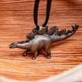 Load image into Gallery viewer, A Saucy Stegosaurus Pendant