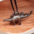 Load image into Gallery viewer, A Saucy Stegosaurus Pendant