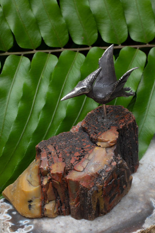 A Top-flight Pteranodon Desk Ornament with Petrified Wood Base