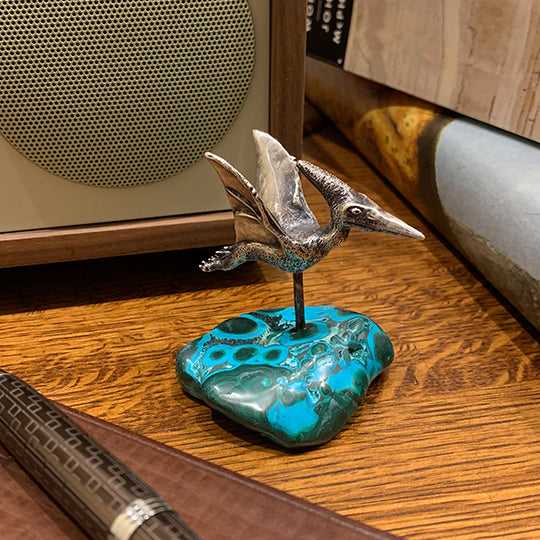A Top-flight Pteranodon Desk Ornament on a malachite-chrysocolla base