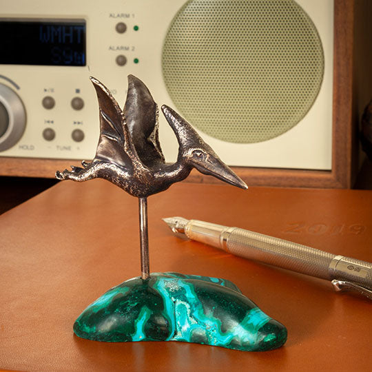 A Top-flight Pteranodon Desk Ornament on a malachite-chrysocolla base
