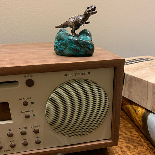 A Righteous T. Rex Desk Ornament on a malachite-chrysocolla base